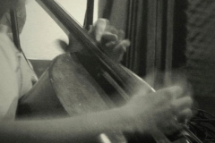 Seth Lutske playing cello  (photo  by Monica Hui Hekman)