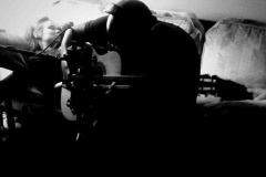 Jimi recording guitar for Snails while Rachel sleeps behind him.